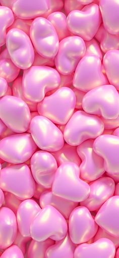 many pink hearts are scattered together in this image, as if they were floating or floating on the ground