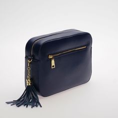 Crossbody Camera Purse - The Stratford in Dark Navy. This leather crossbody bag has classic design and style. The perfect size, it fits all your daily essentials - Phone, Coin Purse, Make Up, Keys Designed in England Full Grain Pebble Leather Yellow Gold Hardware Free Personalisation - Monogram up to four letters Free Swoon Star Keyring with every bag New Improved Wider Matching Leather Strap Matching Leather Tassel Get 20% OFF Our Bag Straps when purchased with any bag Zipped Side Pocket Two In Travel Crossbody Saddle Bag With Smooth Grain, Classic Smooth Grain Crossbody Bag, Classic Smooth Grain Crossbody Shoulder Bag, Classic Soft Leather Crossbody Camera Bag, Travel Crossbody Bag With Smooth Grain, Smooth Grain Crossbody Bag For Travel, Smooth Grain Crossbody Travel Bag, Smooth Grain Travel Crossbody Bag, Herringbone Bag