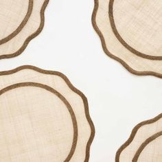 three placemats with brown circles on them