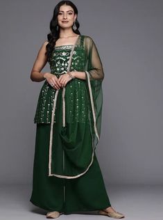 * Floral Embroidered Pleated Sequinned Kurti With Palazzos & Dupatta Pakistani Salwar Kameez / Indian Wedding Dress / Plus Size Cotton Dress Traditional Indian Wear / Salwar Kameez Dupatta / Kurti Palazzo Set / Hand Embroidery kurta * Green Embroidered Kurti with Palazzos with dupatta * Kurti design:- * Floral embroidered * A-line shape * Pleated style * Shoulder straps, sleeveless no sleeves * 2 pockets sequinned detail * Above knee length with flared hem * Georgette fabric * Palazzos design:- * Solid Palazzos * Partially elasticated waistband * Slip-on closure Comes with a potli * Fabric:-   Top Fabric: Georgette   Bottom Fabric: Georgette   Dupatta Fabric: Net *Wash Care:- Dry Clean  AVAILABLE IN 6 SIZES THEY ARE IN FOLLOWING MEASUREMENTS IN INCHES:- XS:- Bust-34/Shoulder-13.5/Top Lengt Green Embellished Straight Kurta Dress, Transitional Green Dress With Mirror Work, Bollywood Style Embroidered Dress With Mirror Work, Embroidered Green Bohemian Sharara, Festive Semi-stitched Embroidered Dress With Mirror Work, Festive Embroidered Semi-stitched Dress With Mirror Work, Bohemian Embellished Salwar Kameez For Festive Occasions, Green Embellished Embroidered Dress For Festive Occasions, Festive Green Embellished Embroidered Dress