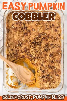 an easy pumpkin cobbler recipe in a glass baking dish with a wooden spoon on the side