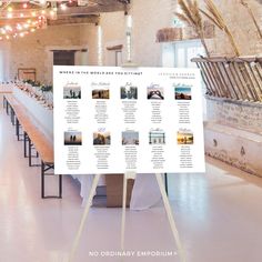 a long table is set up for an event with seating cards on it and lights strung from the ceiling