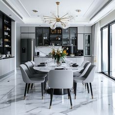 a dining room table with chairs and a chandelier