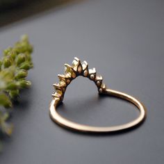 a gold ring sitting on top of a table