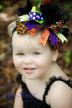 A giant jumble of color and patterns throw a Halloween party on baby’s head in this extravagant fall hair bow that ignores every style rule in the book! Hip, fresh, and modern, baby will adore the clash of colors! Ribbons in leopard print and polka dots, gather with block colored loops in purple, lime green, and orange. Finished with midnight black ostrich feathers and dotted with dazzling jewels. Dare to be different this Fall season!  This is an original creation by Beautiful Bows Boutique for Halloween Headbands, Baby Hair Bows Headbands, Handmade Baby Headbands, Leopard Halloween, Bow Inspiration, Fall Hair Bow, Sweet Pictures, Halloween Tutu, Girls Headband