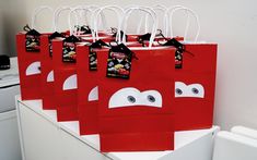 red bags with eyes and noses on them