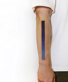 a man's arm with a blue and black stripe on the left side of his arm