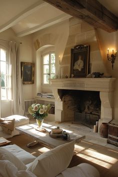 a living room filled with furniture and a fire place in the middle of a room