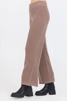 Experience stylish comfort with our Heather Brown Waffle Knit Flared Pants! Made from a soft, breathable knit fabric, these pants are perfect for a casual day out or a cozy night in. The flared design adds a touch of elegance and versatility to your wardrobe. *Our model is 5'9" Elegant Ribbed Pants For Fall, Trendy Wide Leg Pants For Winter Loungewear, High-waisted Ribbed Wide Leg Pants For Fall, Elegant Knit Pants For Loungewear, Trendy Wide Leg Knit Bottoms, Cozy Wide Leg Knit Pants, Cozy Knit Wide Leg Pants, Knit Wide-leg Loungewear Pants, Cozy Knit Wide-leg Pants