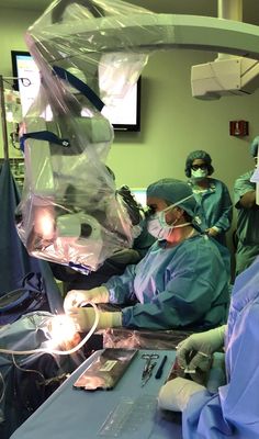 doctors performing surgery in an operating room