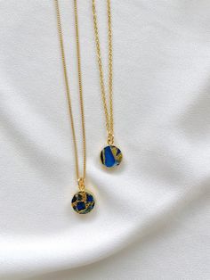 Dainty Sapphire Coin Medallion Pendant Necklace Add a new twist to the classic Sapphire Necklace with these stunners! Features Sapphire Gemstones that are circle cut and framed in gold electroplating. Each medallion pendant is similar, yet unique - making these one of kind. Stones are double sided. *Pendant size is approximately 12mm {Stones will be randomly selected and crafted into your one of a kind necklace. No two pendants are exactly alike} Hangs on your choice of chain: 14k Gold Plated Li Blue Round Pendant Jewelry For Her, Blue Round Pendant Jewelry Gift For Her, Personalized Blue Necklace As A Gift For Her, Personalized Blue Necklace For Her, Personalized Blue Necklace Gift For Her, Blue Round Pendant Necklace For Her, Blue Round Pendant Necklace As Gift For Her, Blue Locket Necklaces For Keepsake, Sapphire Necklace With Adjustable Chain For Gift