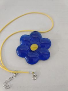 Flower Power- Blue gems fused into this lovely "retro" sixties flower power pendant, added a bail and yellow cord to complete these fun necklaces. Light weight (1.3 ounce). Pendant is 2.5"  round, 1/8th thick, a yellow 17" cord is placed thru a bail resulting in a 10" hang. Fun Necklaces, Blue Gems, Cool Necklaces, Flower Power, Pendant Necklaces, Necklace Etsy, Jewelry Necklace Pendant, Beauty Book, Jewelry Necklaces