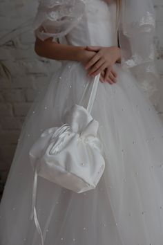 Bags for First Communion flower girl dresses.  Specially designed of unique girls dress pattern for your chic special occasions, first communion, wedding, birthday, pageant, bridesmaid party. The bag can be tailored in complete with choosen dress. Also, you can order communion bag separete.  Item material: upper layer of the bag - satin and lace, zipper lower layer of the bag - satin Item color: white, ivory Note: - please make the measurements before placing an order to ensure the correct size - please allow 1-3cm (0.4-1.2'') differs due to manual measurement. - optional accessories (gloves etc.) we used to make the photo are not included. - please note that monitors displays colors differently and the color of an item may vary slightly from the above images. SHIPPING - We ship worldwide Dress Upcycle, Girls Ball Gown, Gown Bridesmaid, Lace Bag, Bridesmaid Flower, Girl Dress Pattern, Bridesmaid Party, Bag Diy, Bridesmaid Accessories