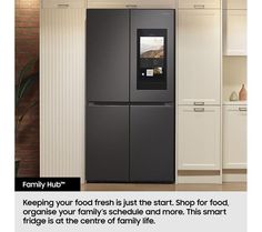 a black refrigerator freezer sitting inside of a kitchen