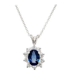 Cornflower blue Sapphire and diamond pendant necklace. Oval sapphire with a halo of 10 round ideal full cut diamonds in 18k white gold. 17.50 inch chain. 2 cornflower blue oval Sapphire, approx. total weight 1.00cts, VS2, 7 x 5mm, natural color simple heat only. 10 round Ideal full cut diamonds, approx. total weight .42cts, F to G, VS 18k white gold Tested and stamped: 18k Hallmark: P 2.2 grams Length: 17 1/2 inches Chain width: 1mm Formal Blue Oval Diamond Necklace, Classic Blue Diamond Cut Diamond Necklace, Classic Blue Diamond Necklace With Diamond Cut, Classic Blue Diamond Cut Necklace, Oval Sapphire Diamond Necklace, Classic Round Sapphire Diamond Necklace, Oval Sapphire Necklace With Brilliant Cut, Blue Oval Diamond Necklace In Fine Jewelry Style, Blue Oval Diamond Necklace Fine Jewelry