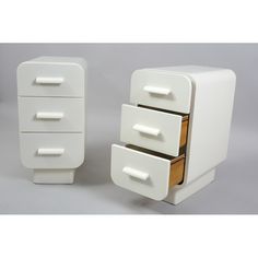 two white drawers sitting next to each other