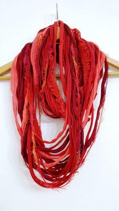 BEAUTIFUL HANDMADE, SCARF NECKLACE in Red. Product description: Handmade, multi-strands  hand cutted cotton stripes  and various different yarn and cotton threads , handmade accessories combined together to make a great neck wrap suitable for all year waring, any occasion, any time. Unusual and beautiful scarf necklace in beautiful ruby red with sparkle yarn, tule yarn and cotton T-shirt yarn.  This piece will make you very fashionable and bring life to any clothing. Make this unique peace yours Yarn Scarves, Red Infinity, Oversized Necklace, Necklace Fabric, Fiber Necklace, Sparkle Yarn, Textile Necklace, Beautiful Scarf, Handmade Scarf