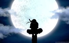 a person sitting on top of a wooden pole in front of a large full moon