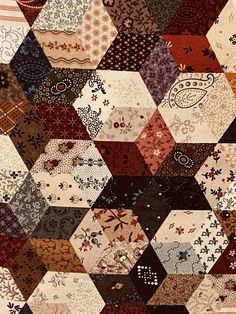 a patchwork quilt with many different colors and patterns