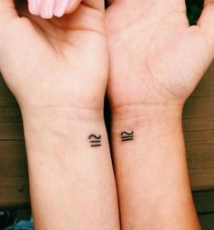 two small tattoos on both wrist are shown with the words small matching tattoos for friends