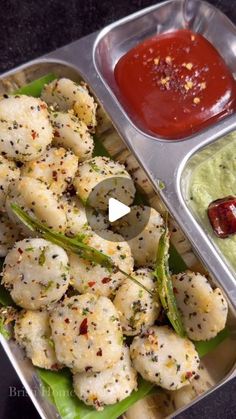 two trays filled with different types of food next to dipping sauce and ketchup