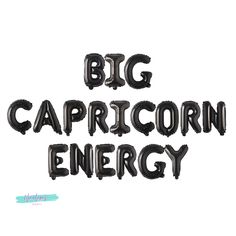 the words big capricorn energy written in black balloons