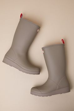 A practical cutie like you won't be winter-ready without the Hunter Play Tall Medium Natural Shearling Mid-Calf Rain Boots! These matte rubber rain boots feature a rounded upper that rises to a 10.5"" mid-calf shaft with a 15.75"" circumference. Soft, faux shearling lining throughout adds some extra comfort to the slip-on design, made easy by the signature striped pull tab at the back. A sturdy flatform sole completes the splash-worthy look! Available in whole sizes only. Logo tag at the front. The Hunter, Logo Tag, Heel Boots, Rubber Heels, High Heel Boots, Pull Tab, Mid Calf, Rubber Rain Boots, Rain Boots