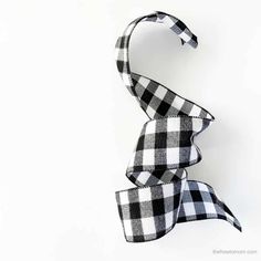 a black and white checkered ribbon on a white background