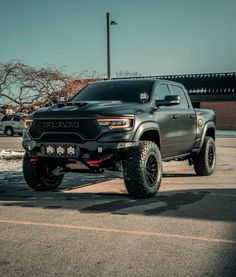 a large gray truck parked on top of a parking lot