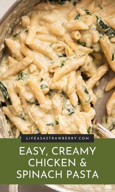 creamy chicken and spinach pasta in a skillet with a serving utensil