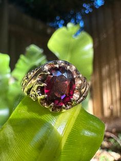 Vintage 14K yellow gold ring with large oval, 10 prong, claw set natural Garnet. Marked 14K. Birmingham hallmarks. Beautiful engraved scrollwork on the shoulders. Garnet is a deep wine red and just glows in the light. Ring size fits like ~ M1/2 or US size 6.5 due to width of band. Oval Engraved Ring With Gemstone In 14k Gold, 14k Gold Oval Engraved Ring With Gemstone, Antique 14k Gold Oval Ruby Ring, Antique Oval Ruby Ring In 14k Gold, Victorian Oval Garnet Ruby Ring, Oval Engraved Ring With Center Stone In 14k Gold, Heirloom Oval Ruby Ring, Ornate Oval 14k Gold Rings, Oval Garnet Signet Ring For Anniversary