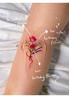 a woman's arm with flowers on it and the words happy birthday written in cursive writing