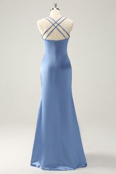 the back of a blue evening gown on a mannequin dummyt, with an open neckline