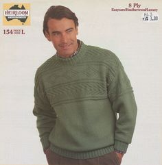 a man wearing a green sweater and brown pants