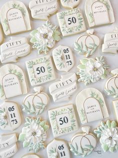 decorated cookies with wedding date and flowers on them