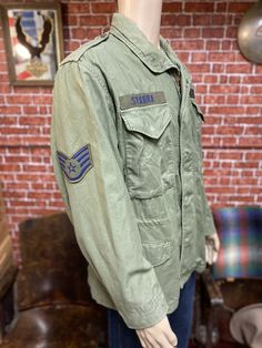 "Vintage 70's M-65 US Air Force field jacket cold weather live green size medium regular. Features zipper and snap on buttons closure, 4 roomy pockets, fully lined, there is a drawstring in the waist for a custom fit, and a hidden hood in the collar, Scovill original zippers. Good used condition with minor wear, the main zipper have small issue but still working well, check photos. Please, check carefully the measurements, photos and description of the article before buying it, we do not accept Green Military Utility Jacket With Multiple Pockets, Green Military Utility Jacket For Streetwear, Green Military Style Utility Jacket For Streetwear, Green Military Cotton Parka, Military Style Green Parka With Pockets, Green Military Parka With Pockets, Military Green Parka With Pockets, Green Military Style Cotton Parka, Green Cotton Military Parka