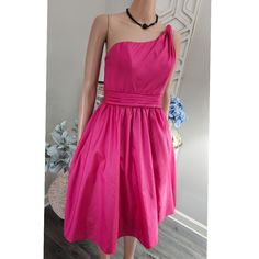 * Nwt * Size 5/6 * Soft Taffeta Texture Fabric * Boned Bodice * Back Zipper Closure * Hidden Side Pockets * Full Skirt Silhouette Approximate Measurements * Chest: 32" * Waist: 26" * Torso: 16" * Length: 39" Thank You For Visiting My Closet! One-shoulder Pink Dress With Ruched Bodice, Pink One-shoulder Dress With Ruched Bodice, Pink Mini Dress With Pleated Bodice For Formal Occasions, Pink Pleated Dress For Prom, Pink A-line Dress With Ruched Bodice, Pink Knee-length Dress With Pleated Bodice, Pink Pleated Prom Dress, Pink Pleated Mini Dress For Formal Occasions, Formal Pink Pleated Mini Dress