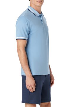 Made from crisp and comfy cotton, this simple yet sophisticated polo easily carries you from the workweek into the weekend. 28 1/2" length (size Medium) Button half-placket Spread collar Short sleeves 100% pima cotton Dry clean or machine wash, dry flat Imported Fitted Light Blue Polo Shirt With Polo Collar, Light Blue Fitted Polo Shirt With Polo Collar, Fitted Light Blue Polo Shirt, Light Blue Polo Shirt For Spring, Fitted Casual Polo Shirt With Contrast Trim, Spring Cotton Polo Shirt With Contrast Collar, Blue Collared Polo Shirt With Placket, Casual Cotton Polo Shirt With Contrast Trim, Spring Cotton Polo Shirt With Spread Collar