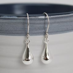 "Beautiful sterling silver teardrop earrings. So elegant and dainty perfect for everyday wear. About 1.25\" L and 1/4\" W Solid 925 Sterling Silver Light weight and comfortable Artisan made in Texas Arrives thoughtfully packaged in a signature kraft jewelry box" Swirl Earrings, Earrings Elegant, Silver Dangle Earrings, Jewelry Studio, Sterling Silver Filigree, Amazon Handmade, Circle Earrings, Silver Earrings Dangle, Elegant Earrings