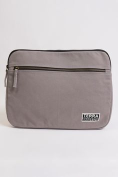 Made with heavy-duty organic cotton canvas and lined with organic cotton for padding, our laptop sleeves are made to protect your machine from jostling. This laptop sleeve can also hold a 14-inch MacBook Pro  Long pull zipper Front pocket with zipper Organic cotton lining for extra padding Lead-free YKK metal zippers and fasteners Laptop Sleeve: 10"H x 13"W x 1.5"D Outside Pocket: 7.25"H x 11"W Your purchase also supports Feeding America's campaign to end hunger by helping donate meals to kids a Practical Laptop Bag With Sleeve, Feeding America, Laptop Sleeve, Macbook Pro, Laptop Sleeves, Front Zipper, Front Pocket, Macbook, Cotton Canvas