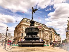 a fountain in the middle of a city square