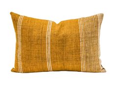 a yellow and white striped pillow on a white background