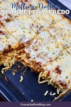 a close up of a pizza on a pan with cheese and other toppings in it