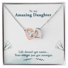 To My Amazing Daughter, Life doesn't get easier, your wings got stronger. Give her the gift that symbolizes your never-ending love. Featuring two lovely hearts embellished with cubic zirconia crystals, this Interlocking Hearts necklace is the perfect accessory for everyday wear. Whether it's a memorable anniversary or a special birthday, make sure to dazzle your special someone by gifting them this stunning necklace. Two heart pendants embellished with CZ crystals High quality polished surgical My Amazing Daughter, Ella Jane, Amazing Daughter, Bonus Daughter, Interlocking Hearts, Get Stronger, Heart Pendants, Hearts Necklace, Verses Quotes