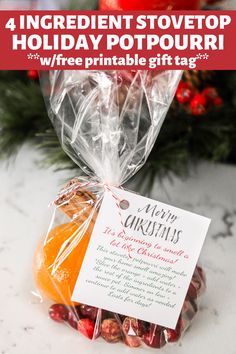 a bag filled with christmas candies on top of a counter next to a tree