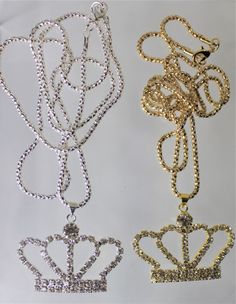 Gold or Silver Jewel Encrusted Crown Pendant, These crown necklaces are perfect for all royalty with all their rhinestones. They would make an exceptional gift for a fashionista. They are exquisite and would make an excellent charm or just as a collectible for the designer at heart. The are about 1.5 in x 2 in and they come with a 28" chain. Costume Jewelry With Rhinestones For Gifts, Party Pendant Rhinestone Necklace With Bling, Party Rhinestone Pendant Necklace With Bling, Party Crystal Pendant Necklace With Rhinestones, Crystal Rhinestones Necklaces For Gift, Metal Rhinestone Pendant Necklace, Glamorous Rhinestone Necklace With Diamond Accents As Gift, Crystal Rhinestone Necklace For Gift, Gold Rhinestone Alloy Jewelry