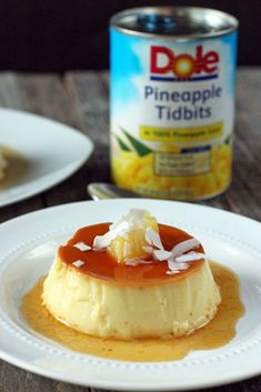 a can of pineapple tidbits next to a plate of food