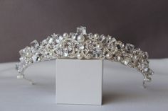 This beautiful wedding tiara is the perfect way to add a touch of glamour to your special day. Made with crystals, this tiara is sure to turn heads. The tiara is made of a sturdy metal frame that is covered in crystals and rhinestones. The crystals are arranged in a delicate pattern that is both elegant and timeless. Height of the tiara - 1.6"( 4 см) This tiara is perfect for any wedding occasion. Incredible tiara that will look great on the bride. The crown is also suitable for any event: a qui Crystal Wedding Crown, Tiara Silver, Crystal Crown Wedding, Crown Silver, Silver Head Piece, Silver Tiara, Pearl Tiara, Bride Tiara, Silver Wedding Jewelry