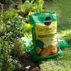 a bag of garden soil sitting in the grass