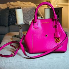 Michael Kors Greenwich Convertible Medium Tote Saffiano Leather Fuchsia Pink W/Red Interior New Condition. Never Used. No Tags. Details -Authentic -Saffiano Leather -Gold Hardware -Magnetic Snap Closure -Clasp Closure Can Be Clinched To Convert To Bucket Bag -The Top Can Be 7" Wide Or Expanded To 13" Wide -Interior Features 1 Zip Pocket And 1 Open Pocket -Front Exterior Slide Pocket With Snap Clasp -4 Protective Feet At The Bottom -Dual Rolled With 4" Drop, Adjustable Buckle Shoulder Strap With Pink Saffiano Leather Crossbody Bag, Pink Saffiano Leather Bag With Removable Pouch, Pink Saffiano Leather Satchel Bag, Pink Saffiano Leather Satchel, Pink Saffiano Leather Evening Bag, Michael Kors Handbags Pink, Red Interior, Red Interiors, Medium Tote